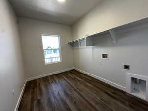 Laundry area featuring electric dryer hookup, dark hardwood / wood-style floors, and hookup for a washing machine