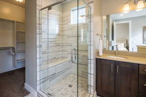 Bathroom featuring vanity and walk in shower