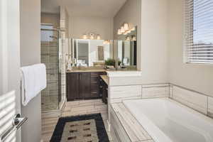 Bathroom with separate shower and tub and vanity