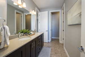 Bathroom featuring tile patterned floors and vanity