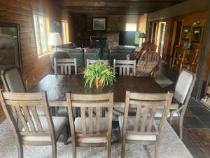 Dining space featuring wooden walls