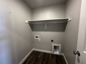 Washroom with wood-type flooring, hookup for an electric dryer, and washer hookup