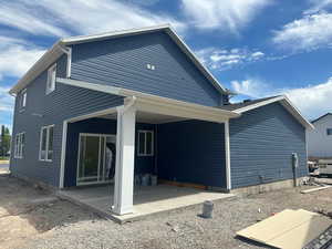 Back of house with a patio area