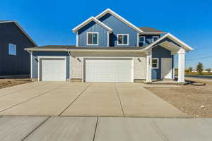 View of front of property featuring a garage