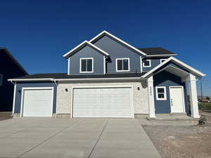 View of front of house with a garage