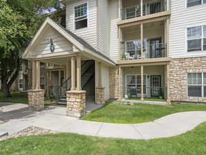 View of front of home featuring a balcony