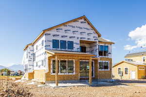 Rear view of property featuring a mountain view