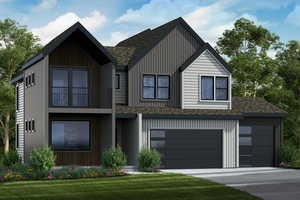 View of front facade with a garage, a front lawn, and a balcony