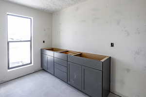 Bathroom featuring a wealth of natural light and tile patterned floors