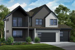 View of front of home featuring a garage, a front lawn, and a balcony