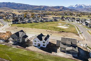 Birds eye view of property with a mountain view