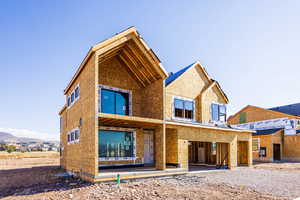 Rear view of property with a mountain view