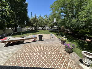 View of patio featuring a trampoline, and a wooden deck