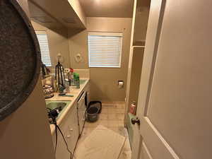 Bathroom featuring tile patterned floors and vanity