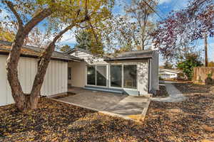 Rear view of house with a patio