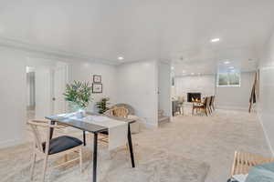 Office featuring light colored carpet and a stone fireplace