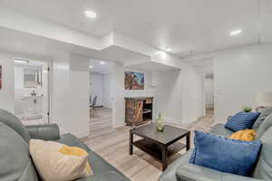 Living room featuring light hardwood / wood-style floors and sink