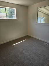 Empty room with carpet flooring