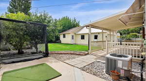 Large covered patio, detached 2 car garage and small RV parking