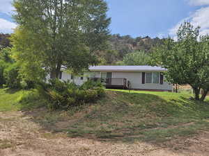 Exterior space featuring a yard and a deck