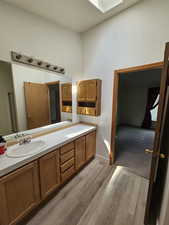 Bathroom featuring hardwood / wood-style floors and vanity