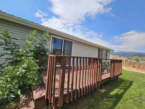 Wooden deck with a yard