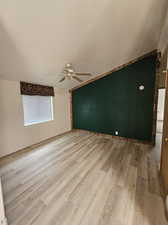 Empty room with light wood-type flooring and ceiling fan