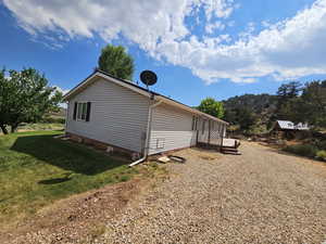 View of home's exterior with a lawn