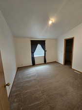 Unfurnished room with carpet floors