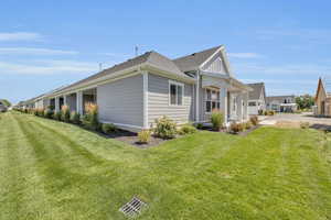 View of home's exterior with a lawn