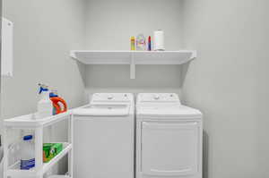 Laundry room featuring washing machine and dryer