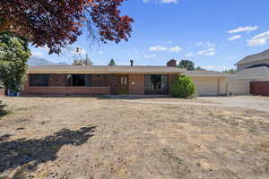 Single story home with a garage