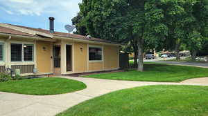 View of front of house with a front yard