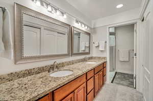 Bathroom featuring dual vanity and tile patterned flooring