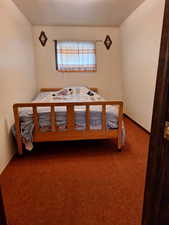 Unfurnished bedroom featuring carpet flooring