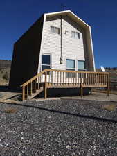 Front of property featuring a wooden deck