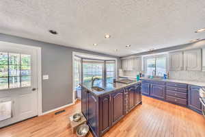 Kitchen serves the chef in the home.  Large bay window.