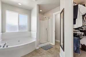 Separate garden tub and good-sized shower in primary bathroom