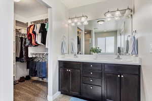 Primary bath with 2 sinks and large walk-in closet