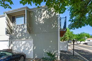 View of side of property with a garage