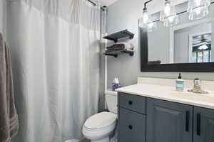 Bathroom with toilet and vanity