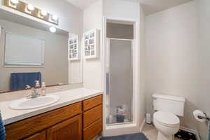 Bathroom with a shower, toilet, and vanity