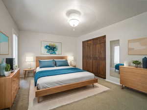 Carpeted bedroom featuring a closetVIRTUALLY STAGED