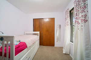 View of carpeted bedroom