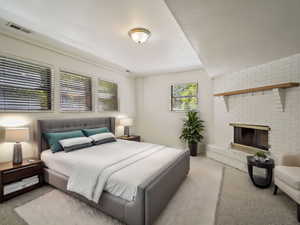 Carpeted bedroom with a fireplaceVIRTUALLY STAGED