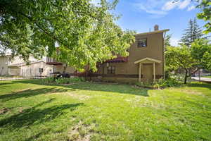 View of backyard with walkout basement door