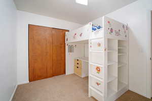 Bedroom with light carpet