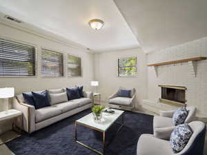 Carpeted living room with a fireplaceVIRTUALLY STAGED