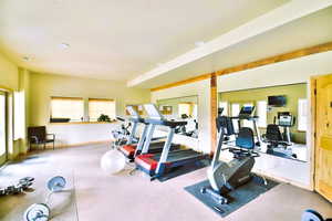 Gym featuring exercise equipment