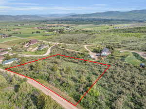 Birds eye view of property with a mountain view